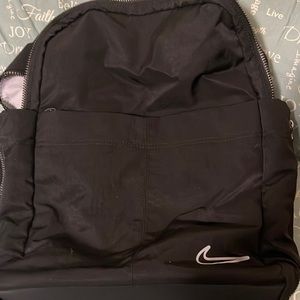A black Nike one luxe backpack